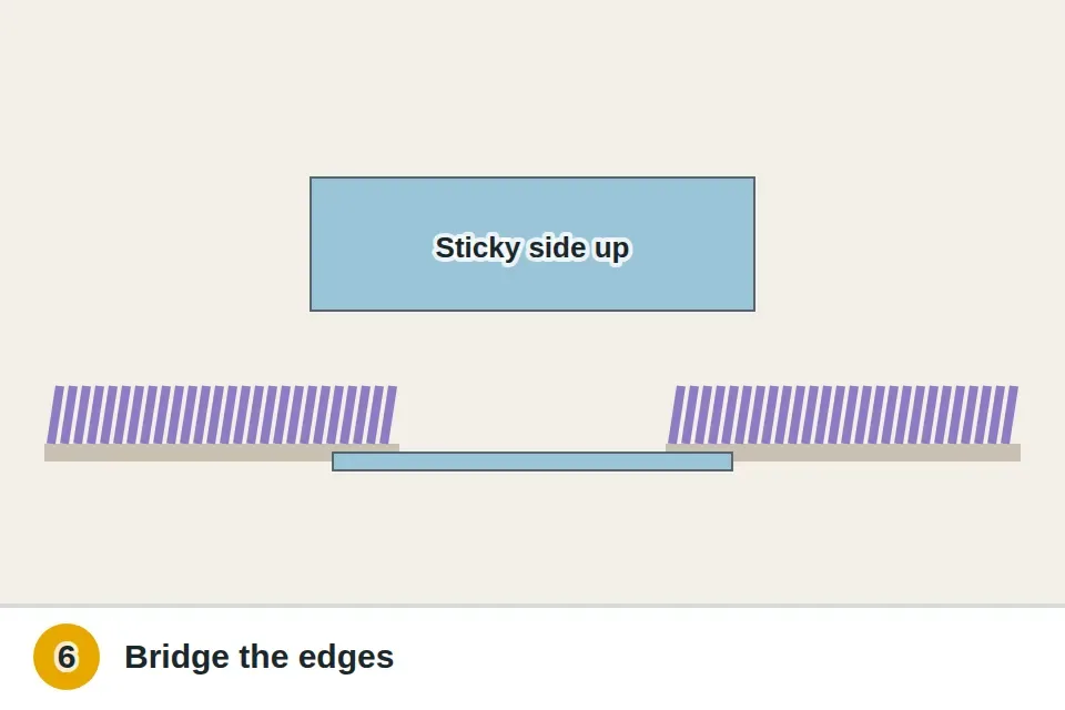 Double-sided carpet tape slid under the hole so it bridges the edges of the surrounding carpet, sticky side up