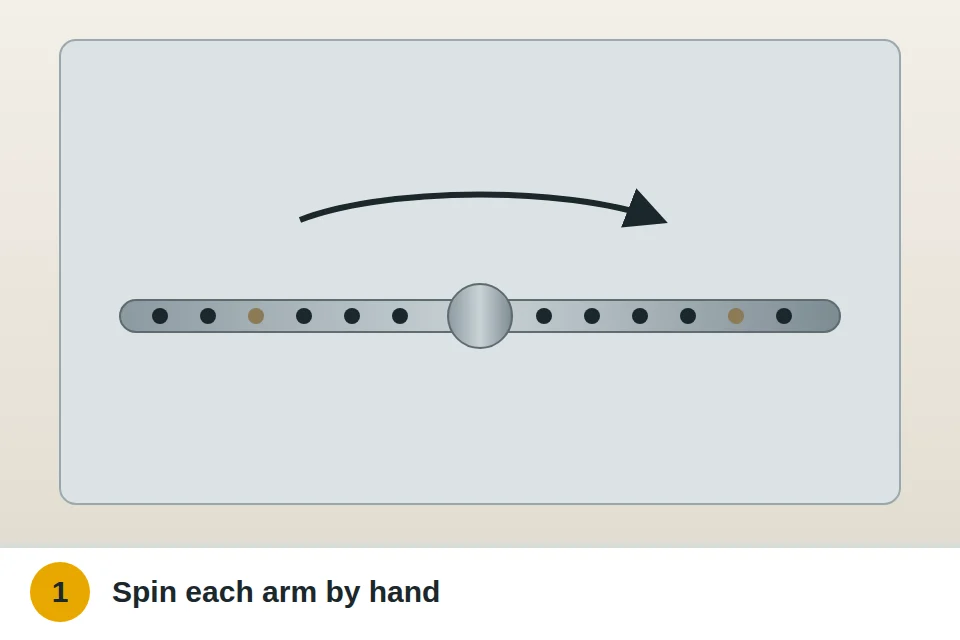 Hand spinning a dishwasher spray arm to check it turns freely