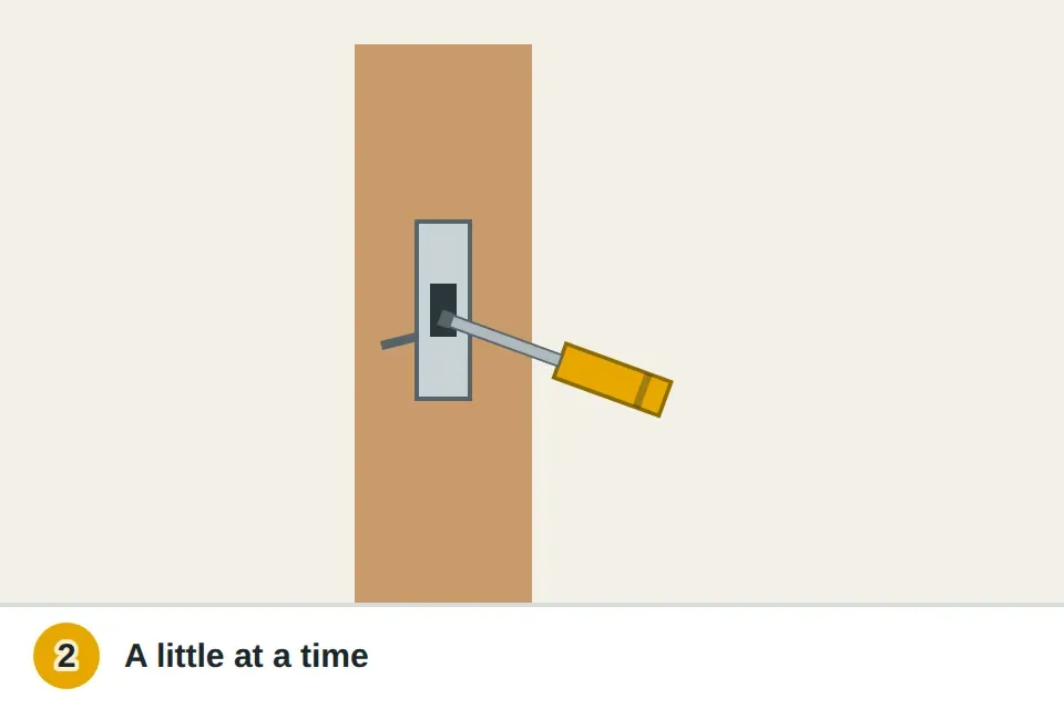 Flathead screwdriver bending the small tab inside a strike plate slightly toward the door stop