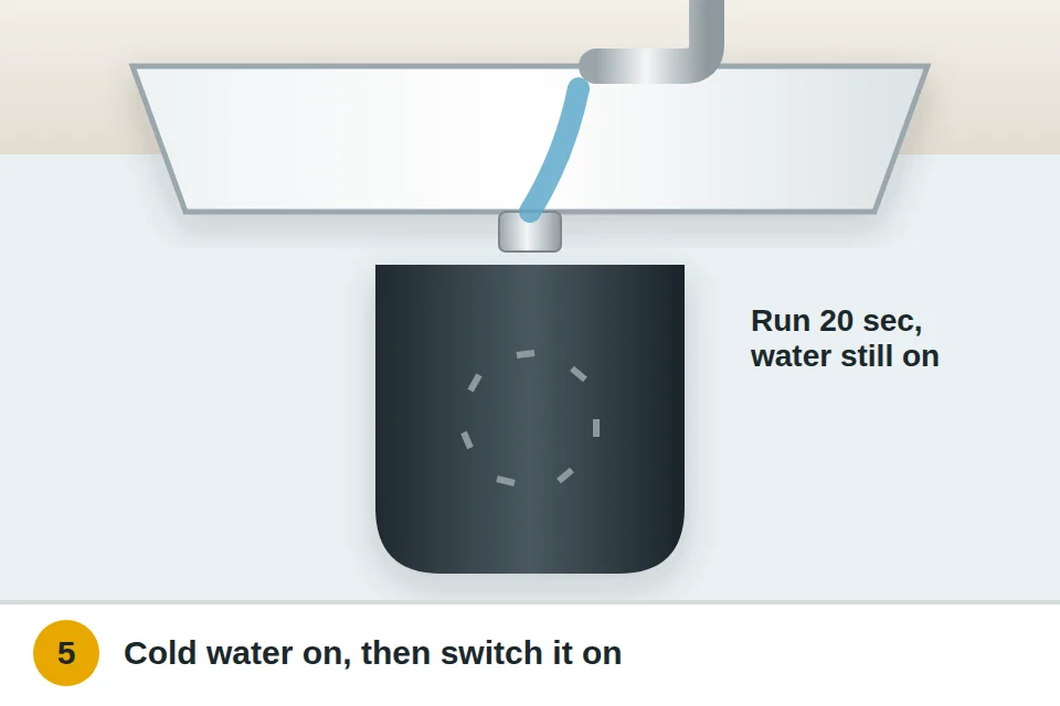 Cold water running into the sink drain while the garbage disposal runs