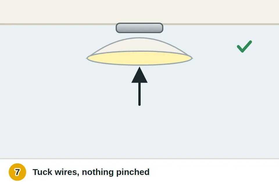 Wires folded into the box and the fixture canopy attached to the bracket