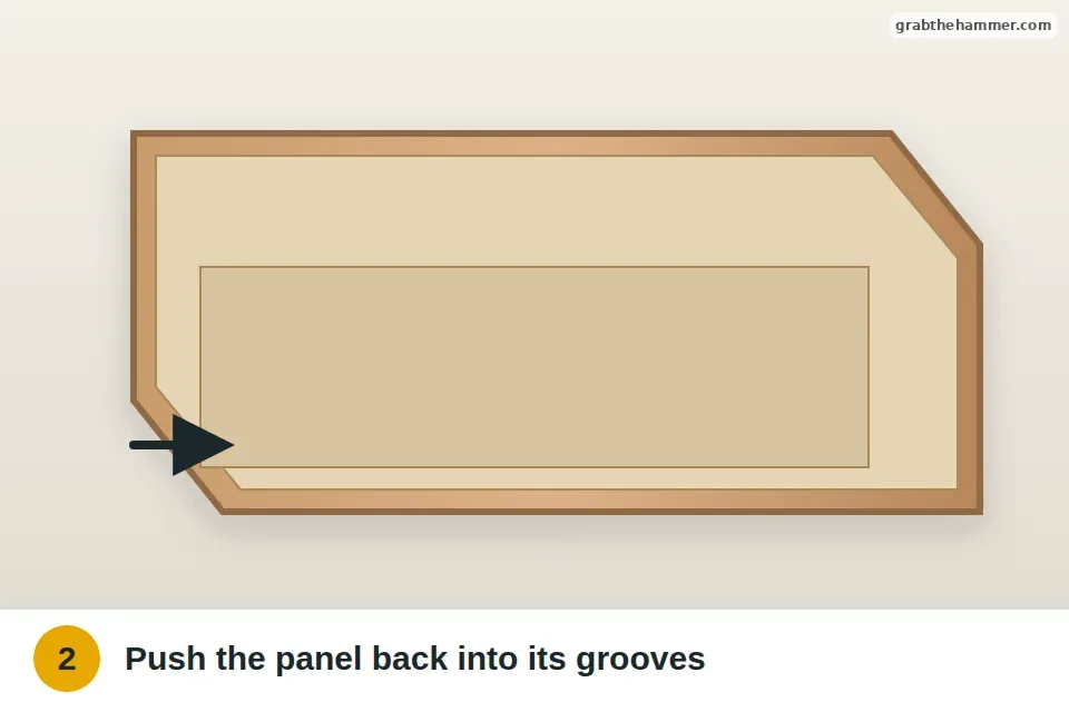 Drawer bottom panel pushed back into the grooves along the sides and front