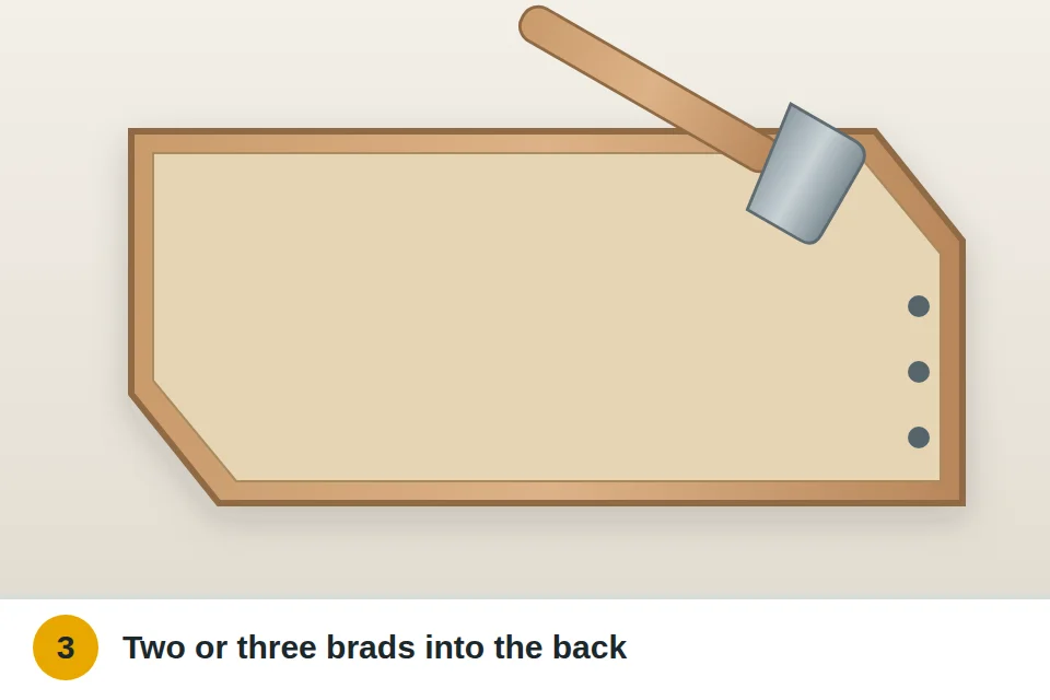 Small brad nails hammered through the drawer bottom into the back of the drawer