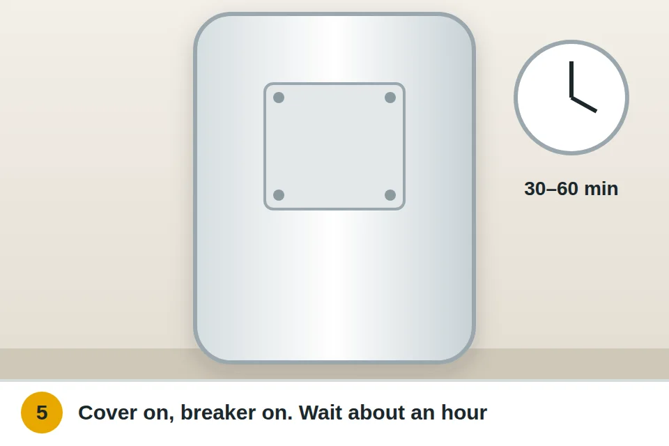 Insulation and cover back on the water heater, breaker on, and a clock showing about an hour to reheat
