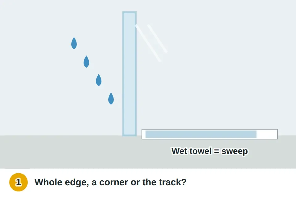 Shower running at a closed glass door with a dry towel along the outside bottom edge showing a wet patch along the whole bottom
