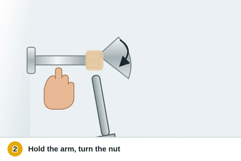 Rag-wrapped wrench turning the shower head nut counterclockwise while one hand holds the shower arm steady