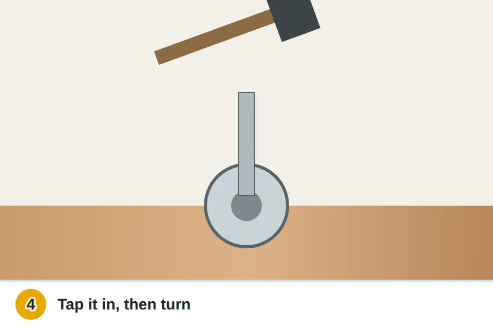 Hammer tapping a slightly larger Torx bit into a stripped screw head so it bites into the metal